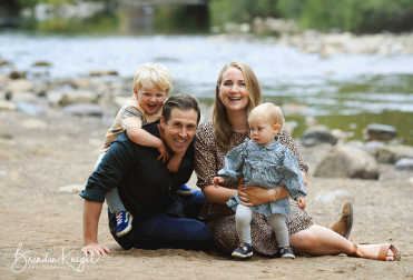 Family sat on bank of river in Richmond North ~Yorkshire
