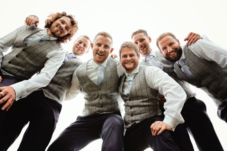 looking up at groomsmen