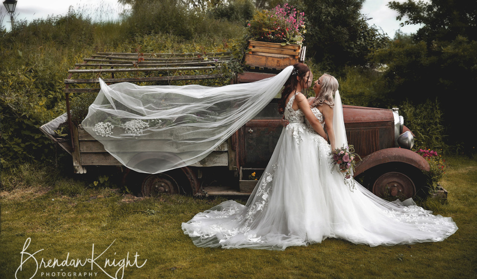 Two brides kissing on their wedding day at Skipbridge north y